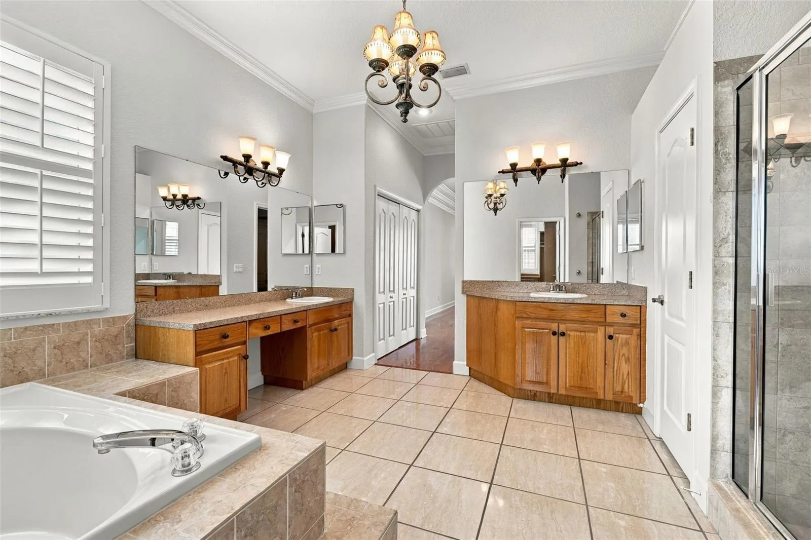 Primary EnSuite Bathroom has separate Vanities! Water Closet behind a door and Walk in Shower!