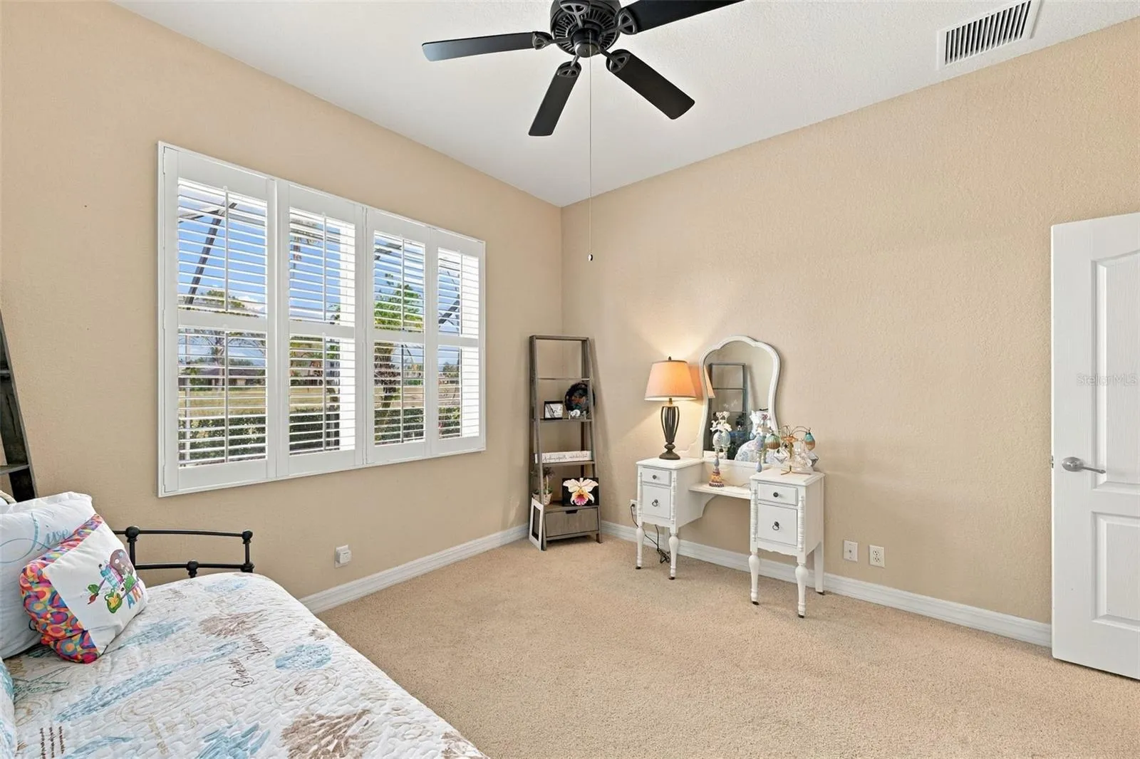 This room offers a spectacular view of the pool area and golf course.