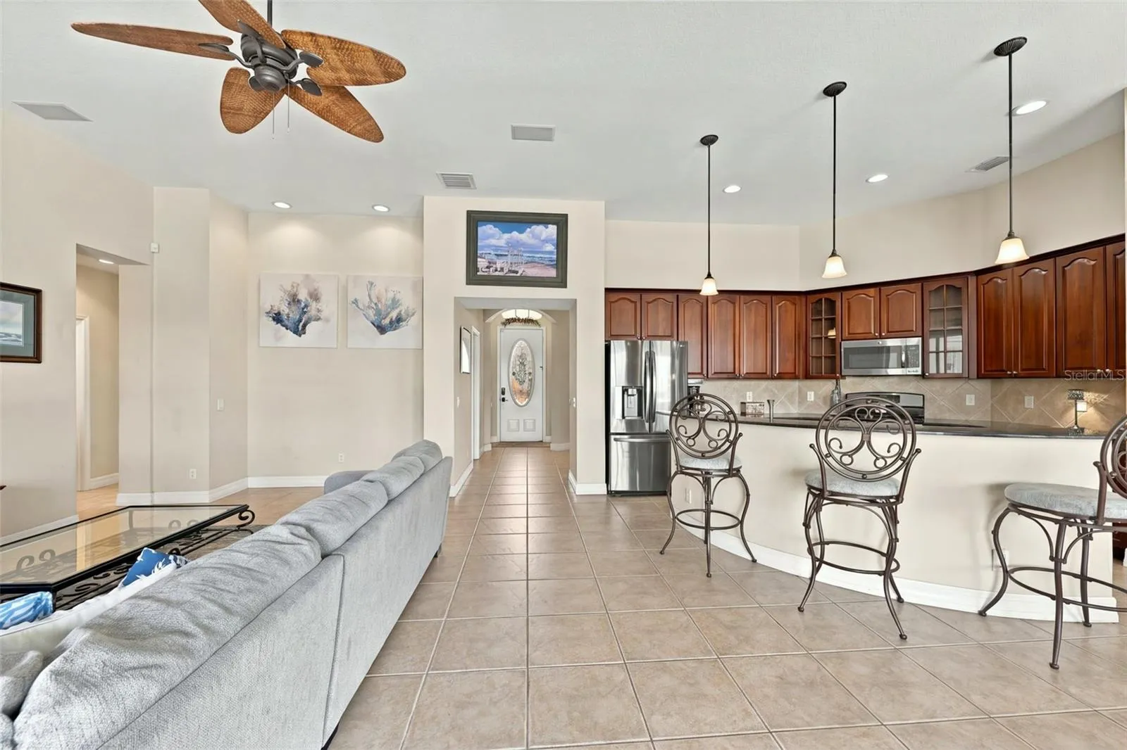 Open, bright and spacious with high ceilings and contemporary light fixtures.