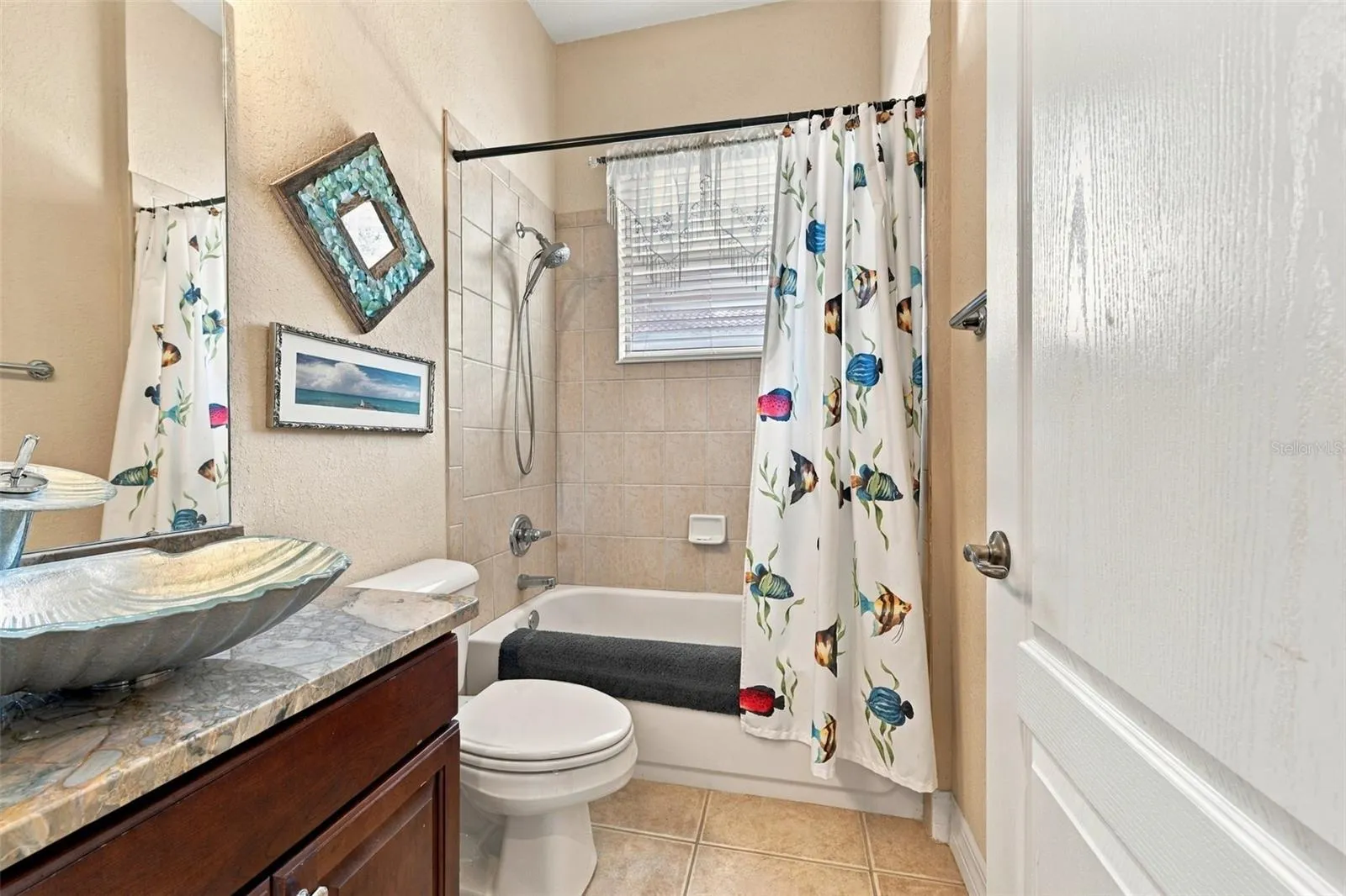 The bathroom is next to Bedroom #3 and beautifully updated in every detail.