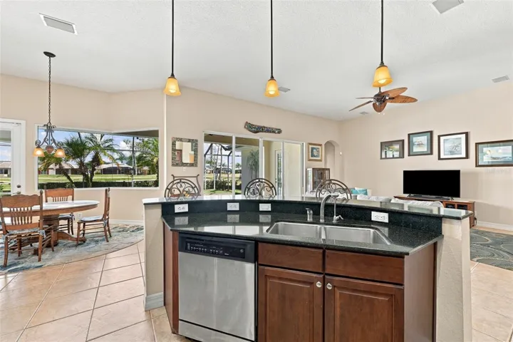 Open to the entire living area and the outside pool area, you are always in the action.  With both a breakfast bar and dinette, you have plenty of room for guests and diversity.