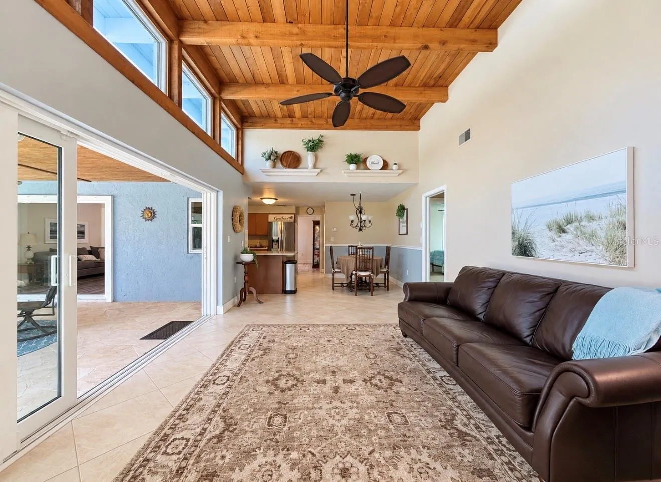 Family room with natural light and fireplace off 2nd and 3rd bedroom hallway
