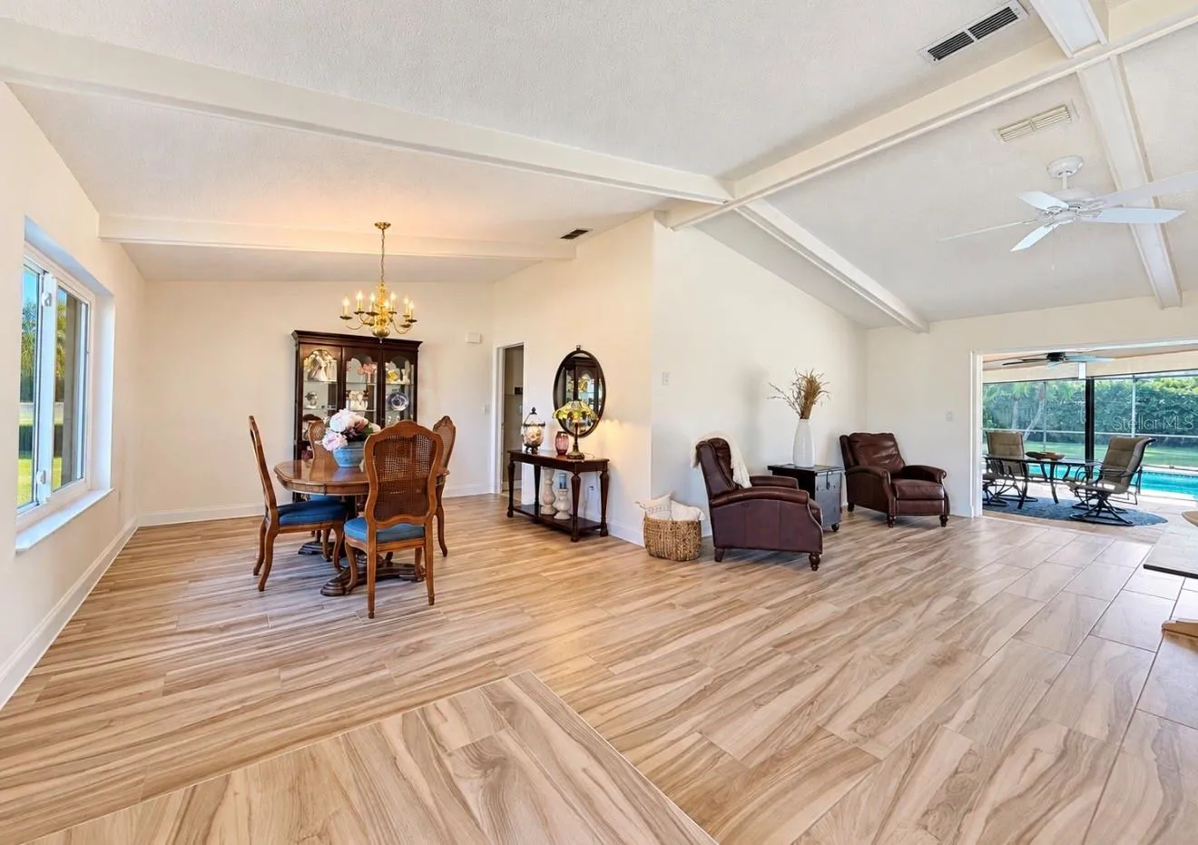 open dining living area leads to pool lanai