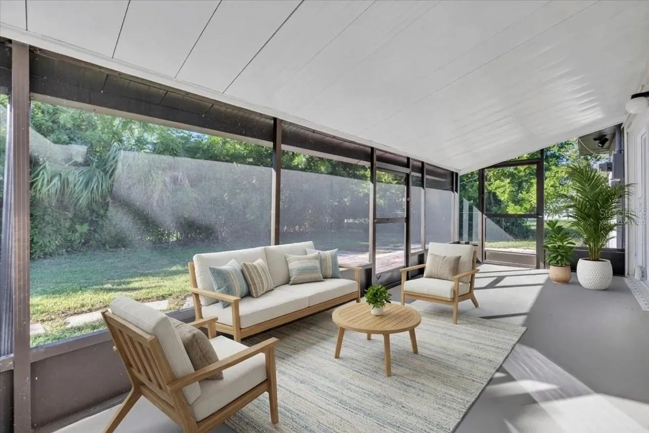 Screened back porch, virtually staged