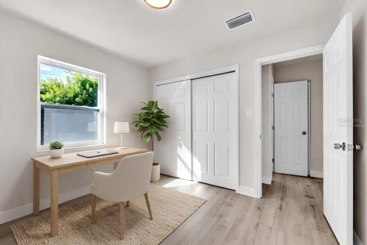 Bedroom shown as home office, virtually staged