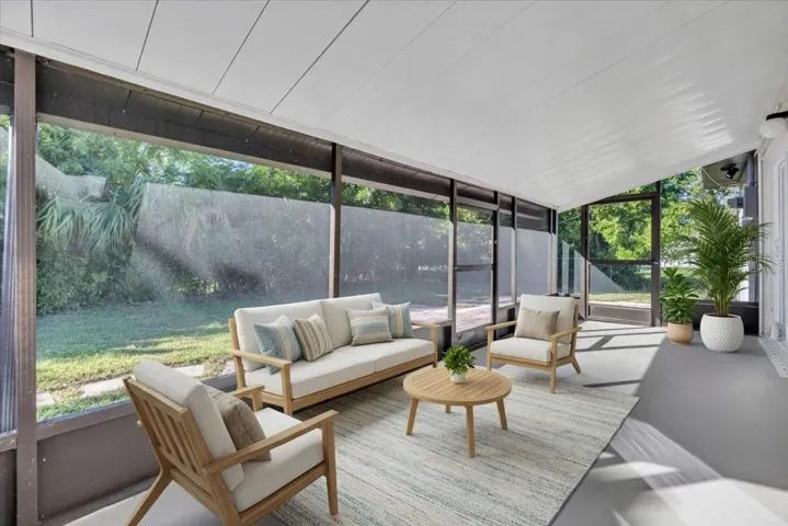 Screened back porch, virtually staged