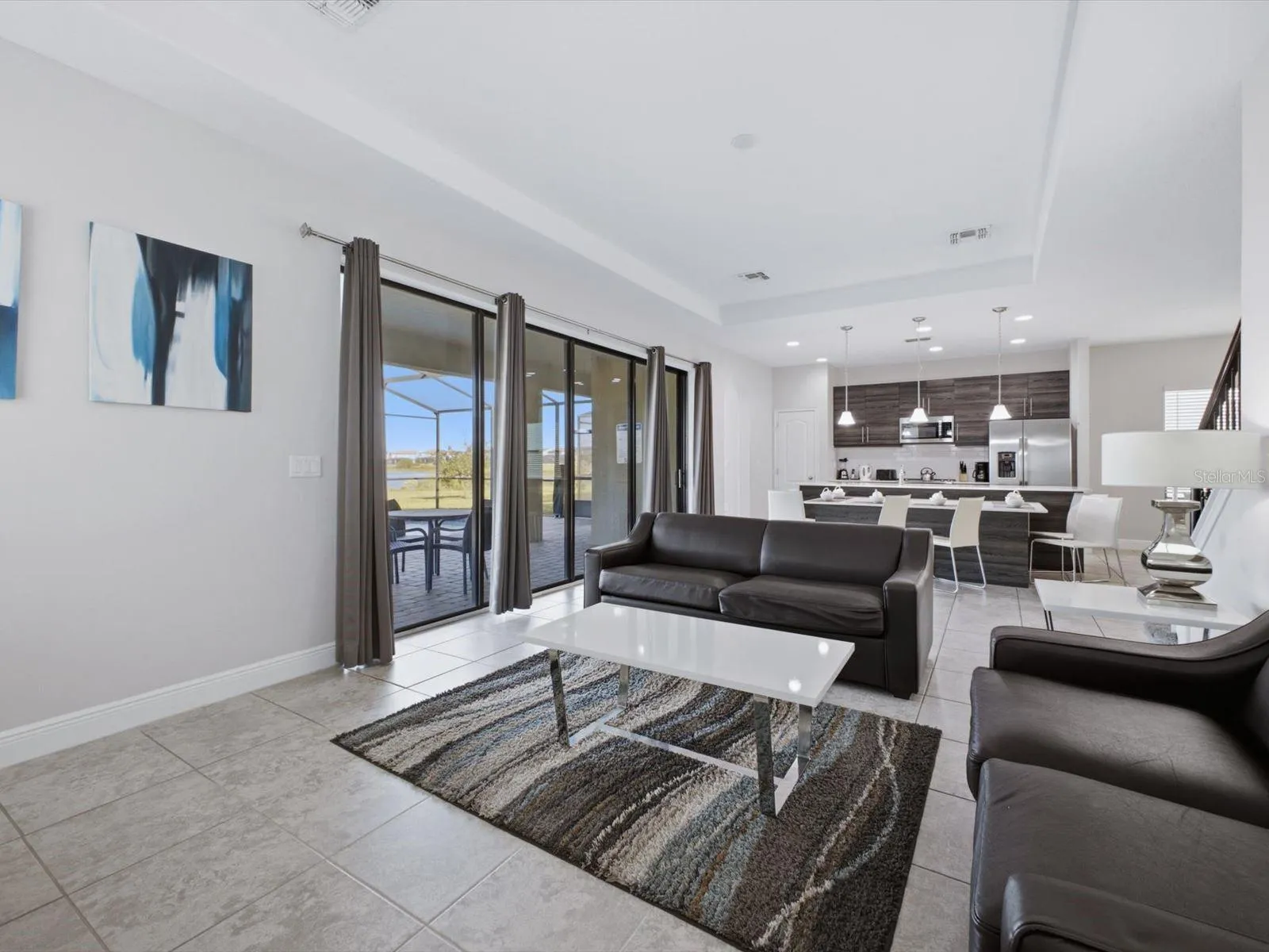 Living room with view into kitchen