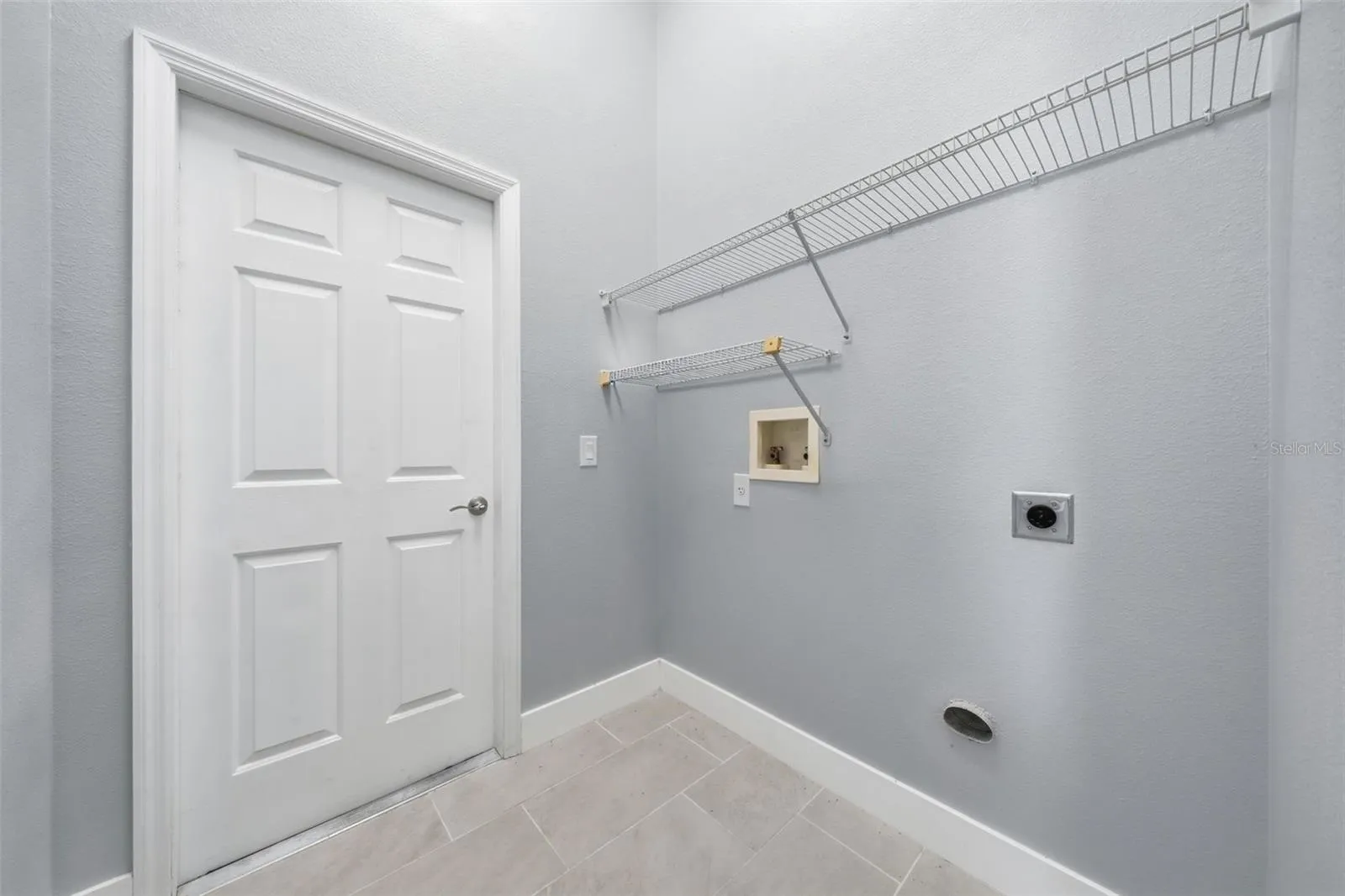 Laundry room leading to the garage