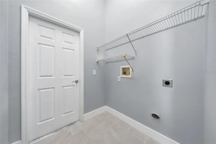 Laundry room leading to the garage