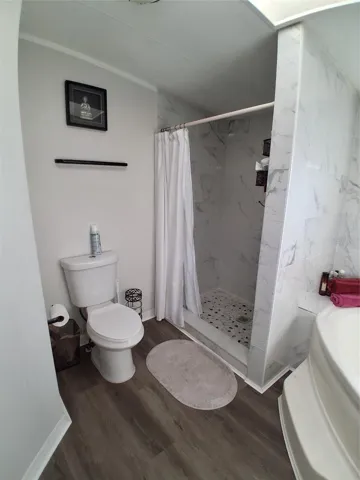Primary bath also has a walk-in shower for great convenience for everyone.