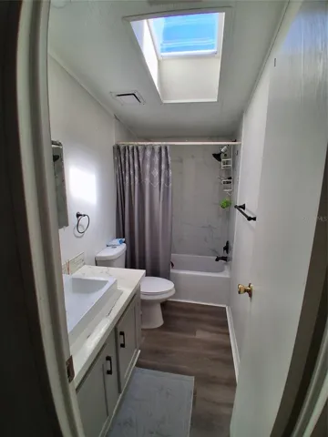 The guest bath has a newly installed skylight allowing for natural light.