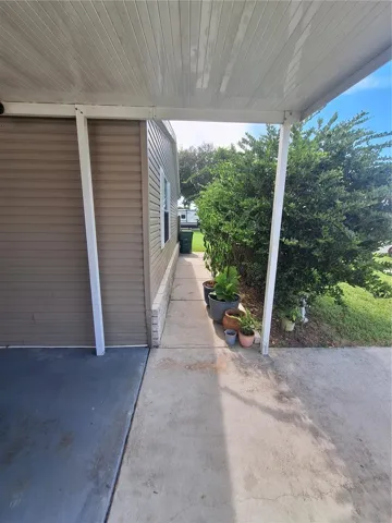 Walkway behind the front landscaping to the side and bank yard.