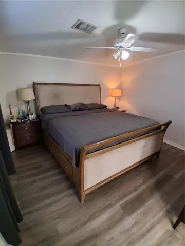Primary bedroom showing the end tables on each side of the king size bed.