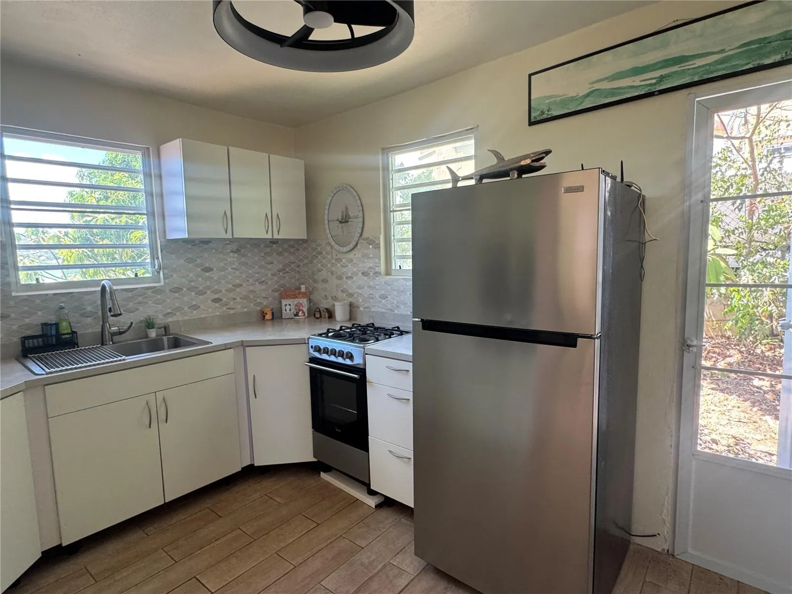 Airy kitchen with plenty of cabinets and counter space