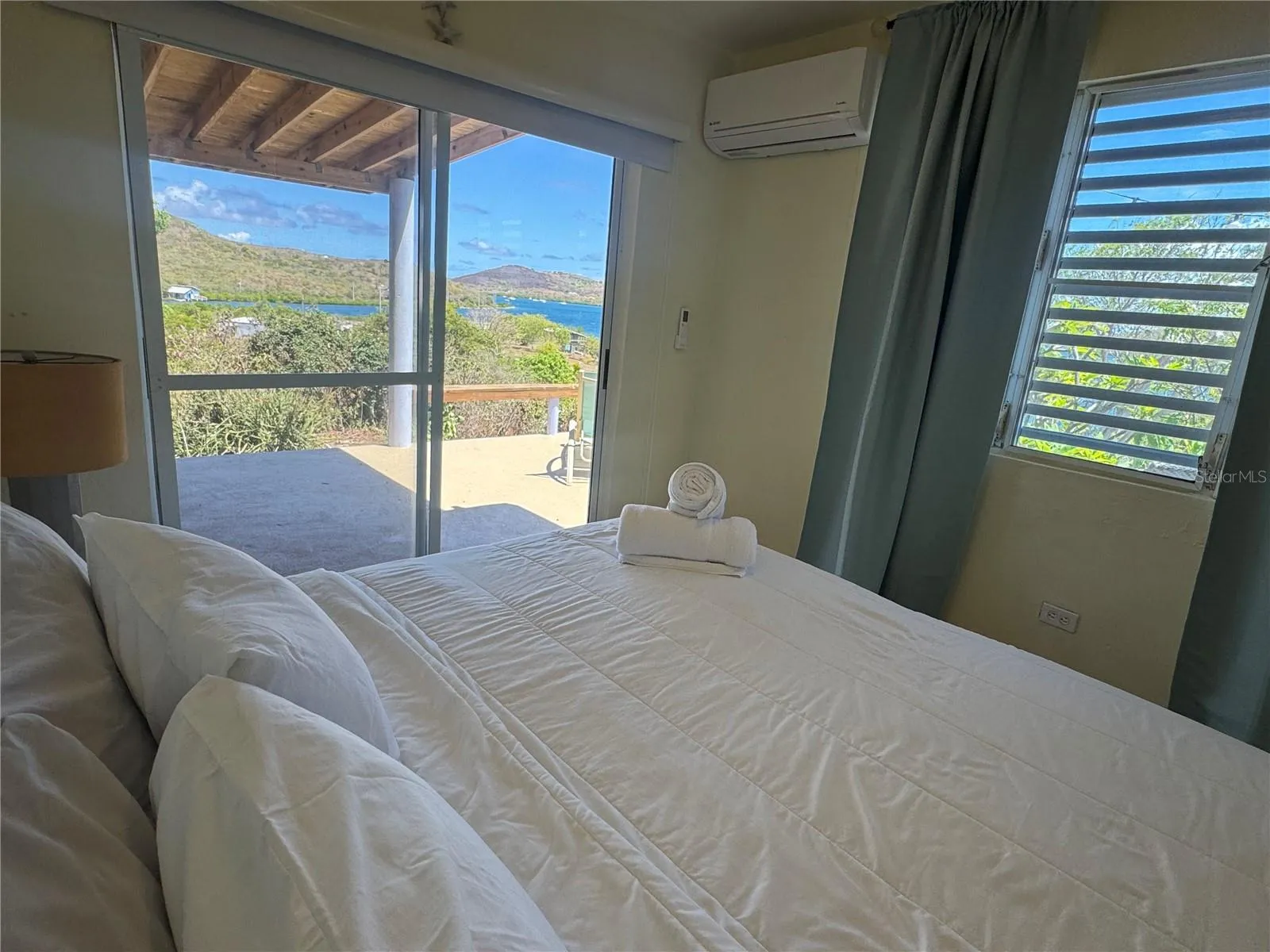 Wake up to the glistening sea.