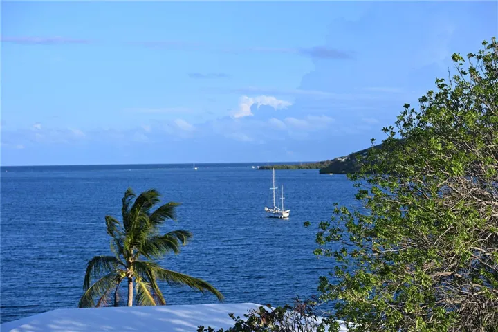 The view is 180 degrees of blue bay and the entrance to the Caribbean Sea.