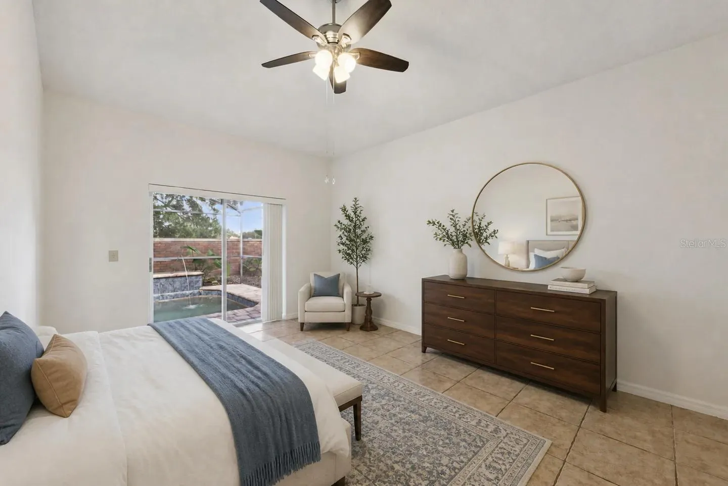 Primary bedroom on the 1st floor, with access to the pool.