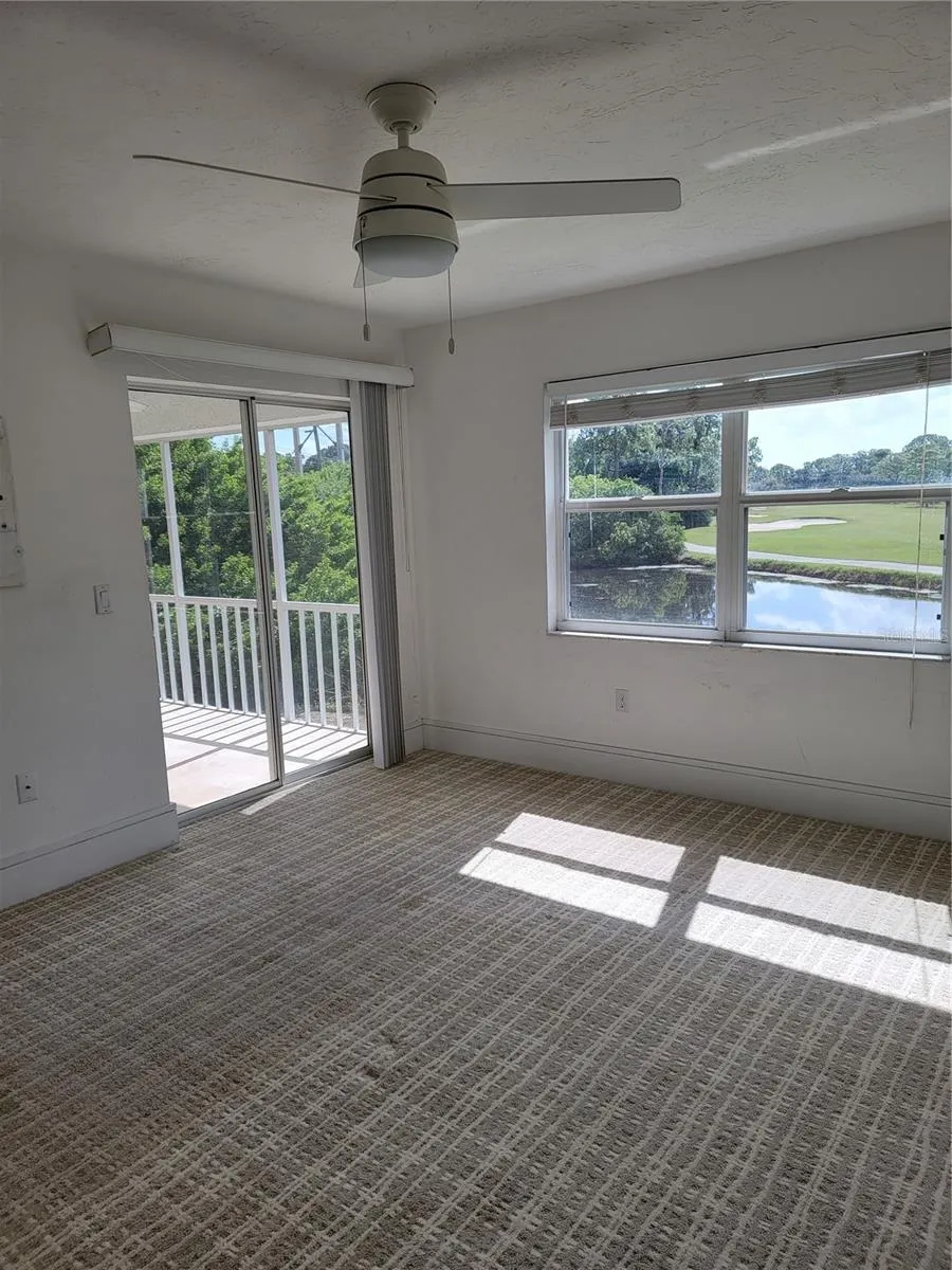 Wake up in the primary bedroom to a peaceful vista