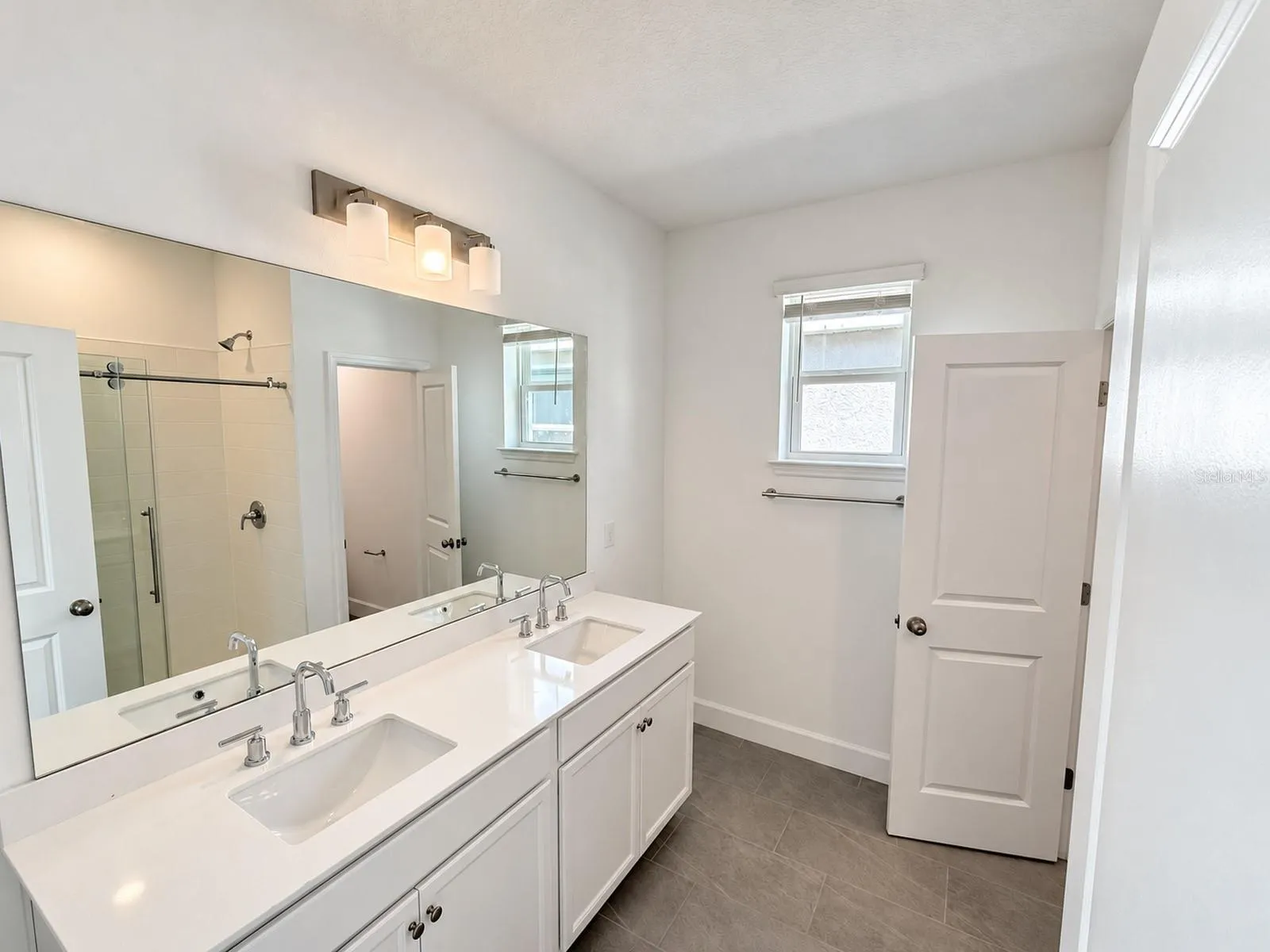 Main house: primary bathroom with dual vanity