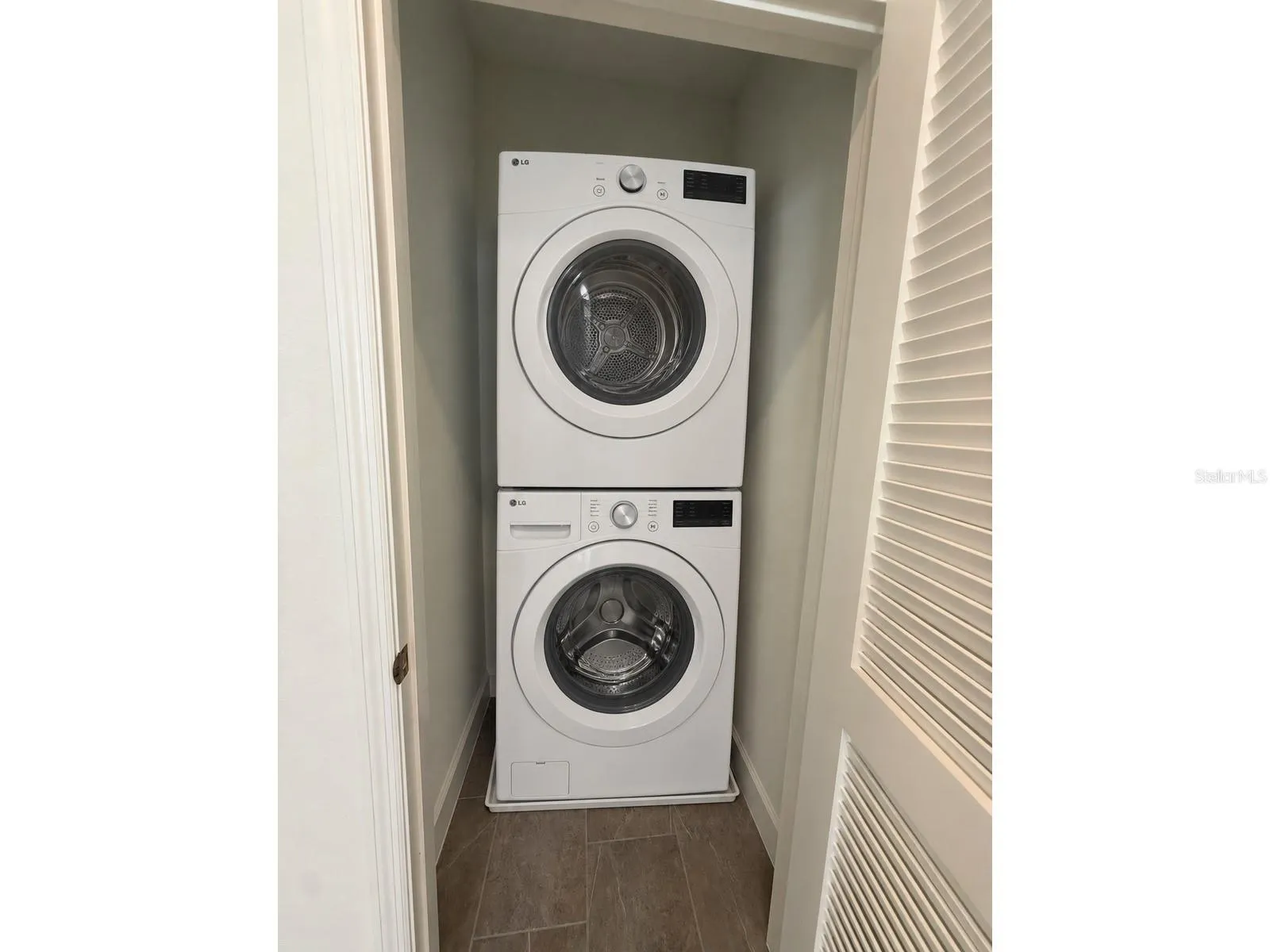 Studio: laundry room with washer and dryer