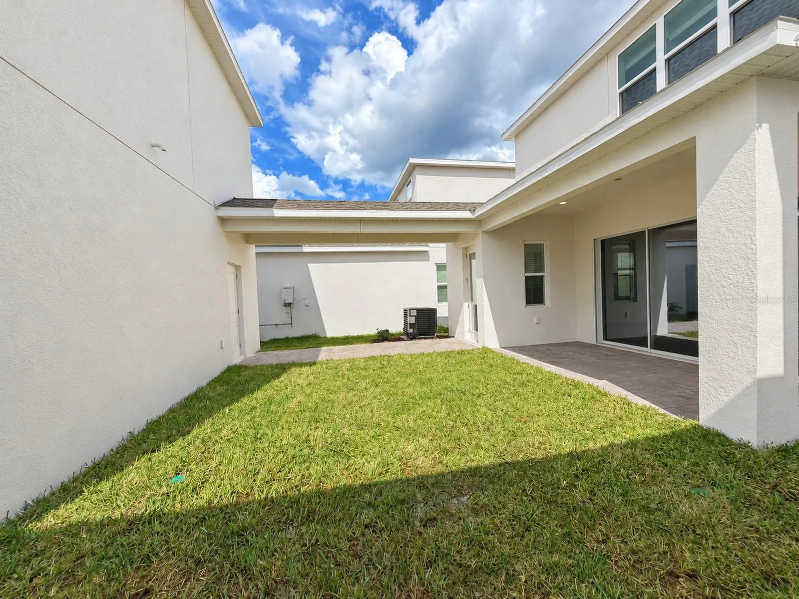 Courtyard between main house and detached garage