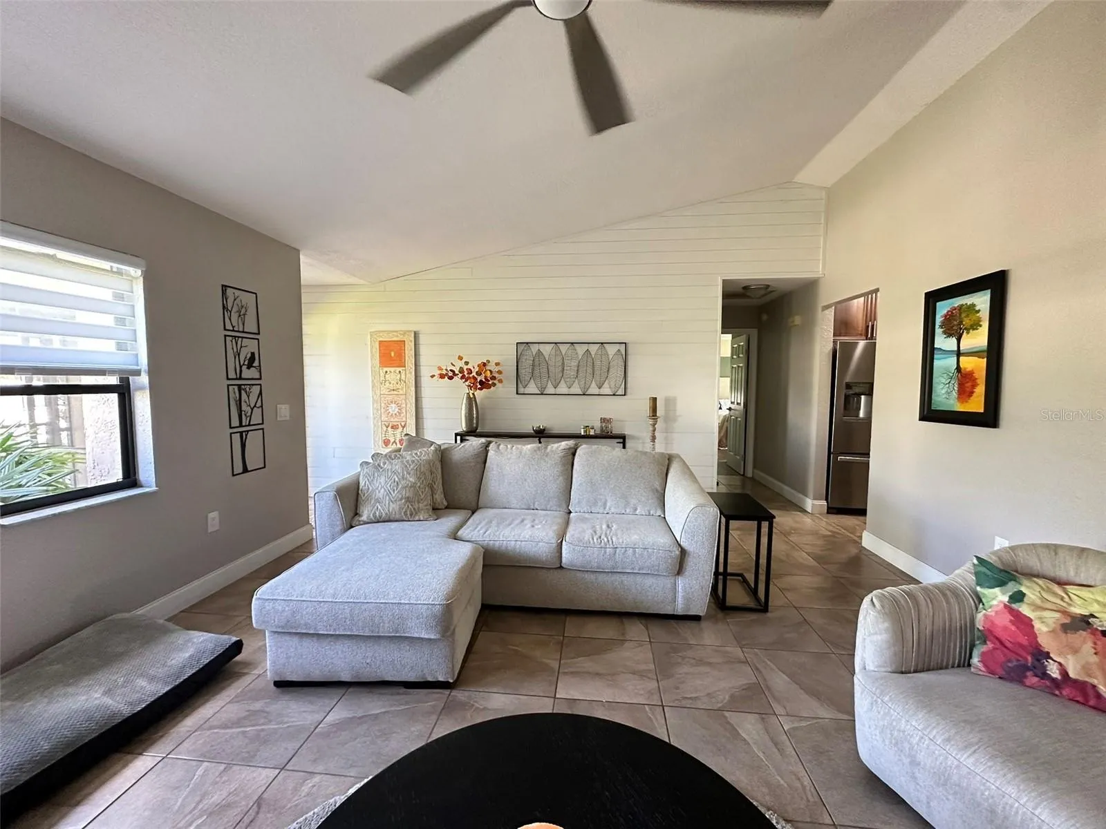 Living room - far wall is upgraded with shiplap