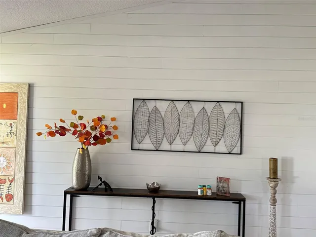 One wall of the living room has been upgraded with shiplap
