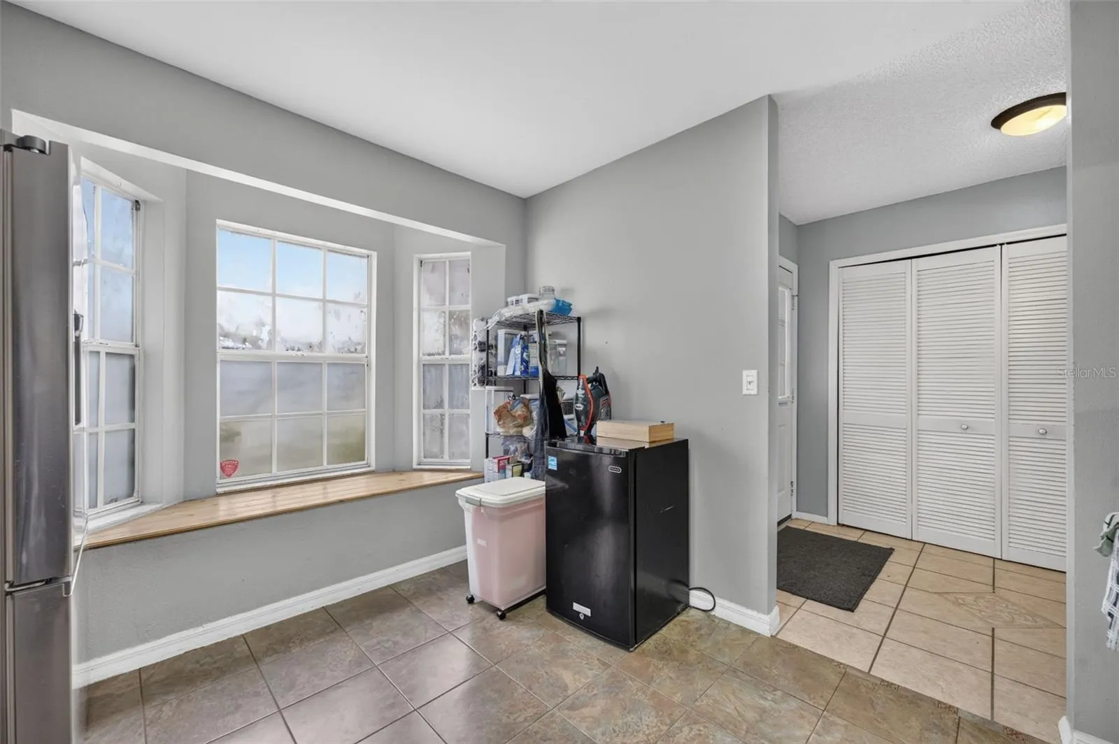 Bay window in the kitchen is just darling! Extra space for your pantry backstock too.