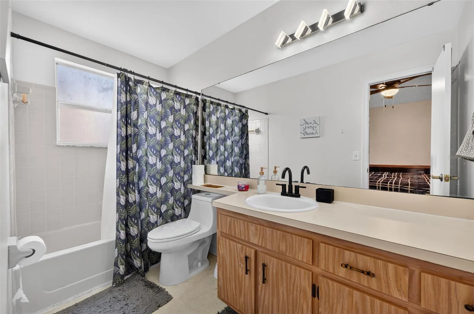 Ensuite bathroom upstairs with large vanity.