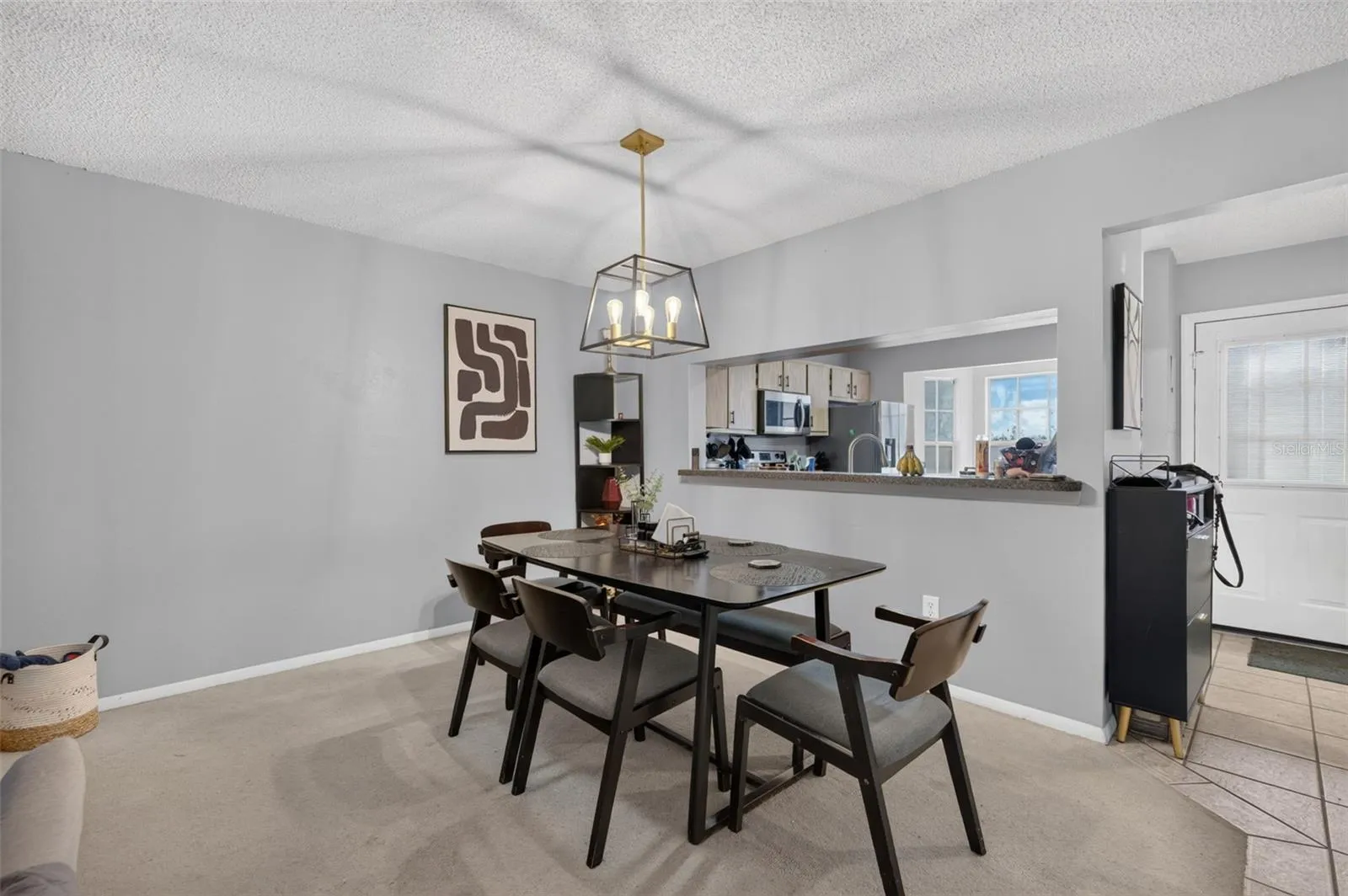 Dining space with opening to kitchen.