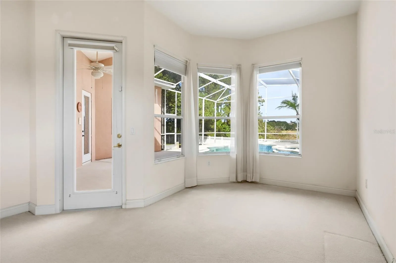 A windowed nook extends the primary suite with space for a private sitting area, readingcorner, or home office.