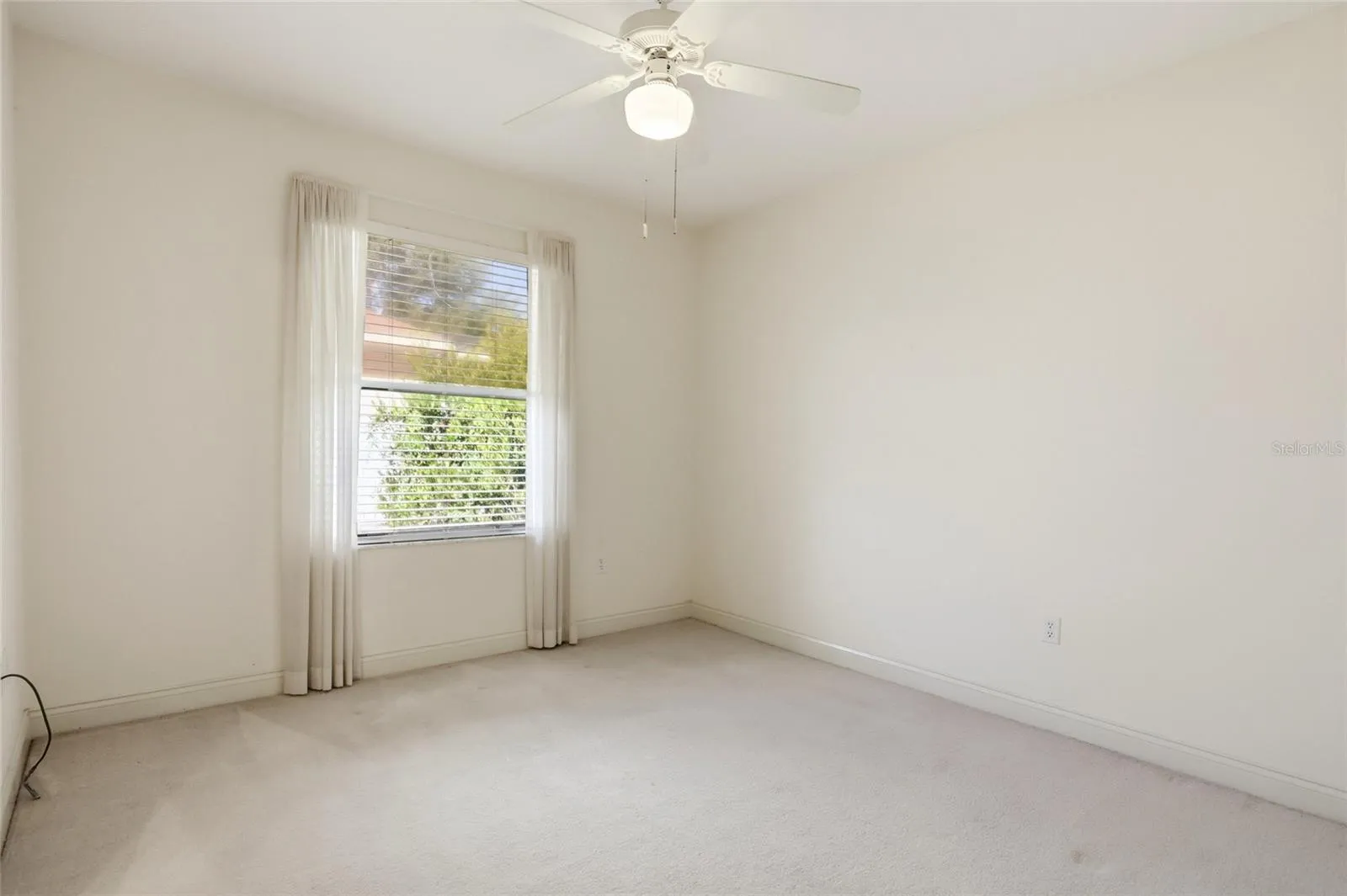 Additional guest bedroom offers flexible space for sleeping, a home office, or hobbies in this four-bedroom Glen Abbey home.