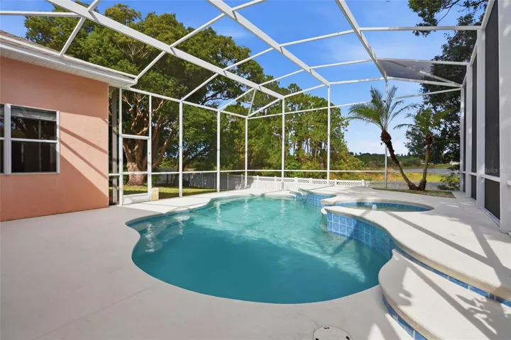 Screened pool with water views at this Glen Abbey home in DeBary,Florida.
