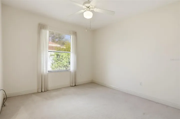 Additional guest bedroom offers flexible space for sleeping, a home office, or hobbies in this four-bedroom Glen Abbey home.