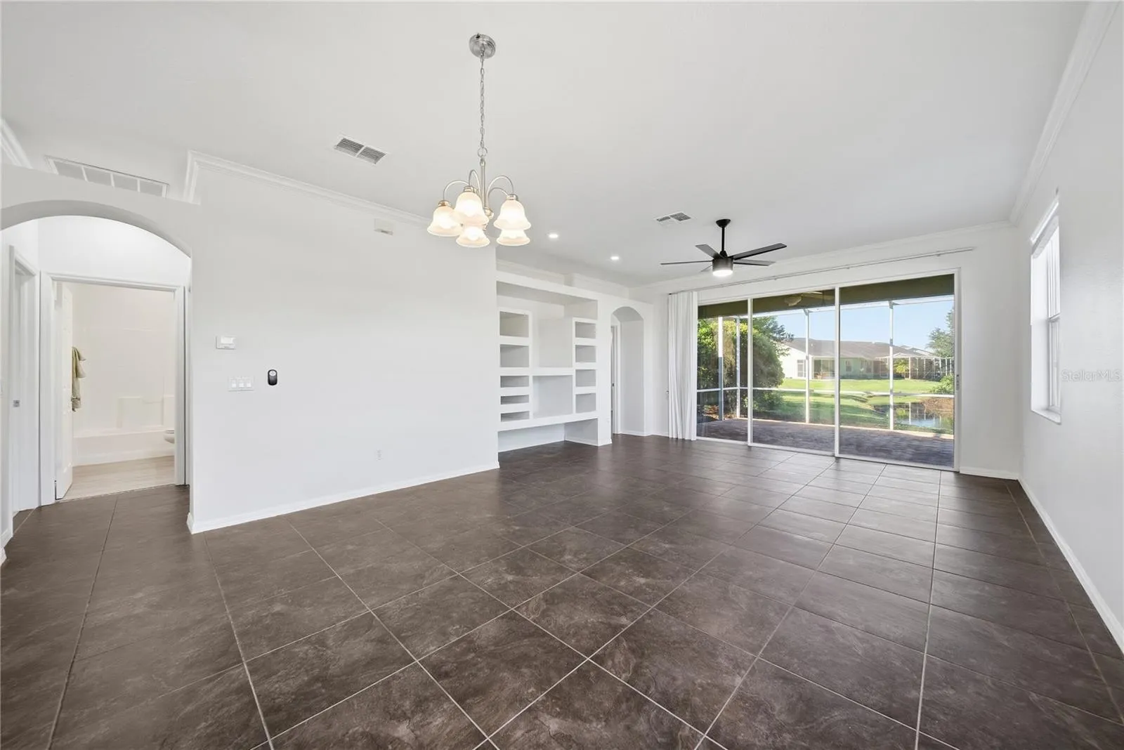 Your view out into your lanai with preserve and a small stream running through in back.