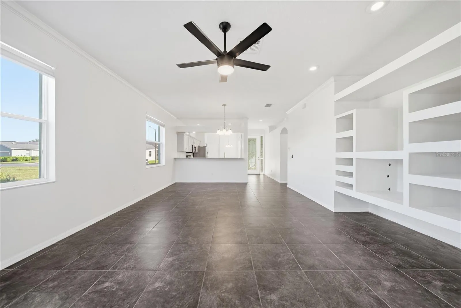 Large Combined Living space and dining area that has lots of windows