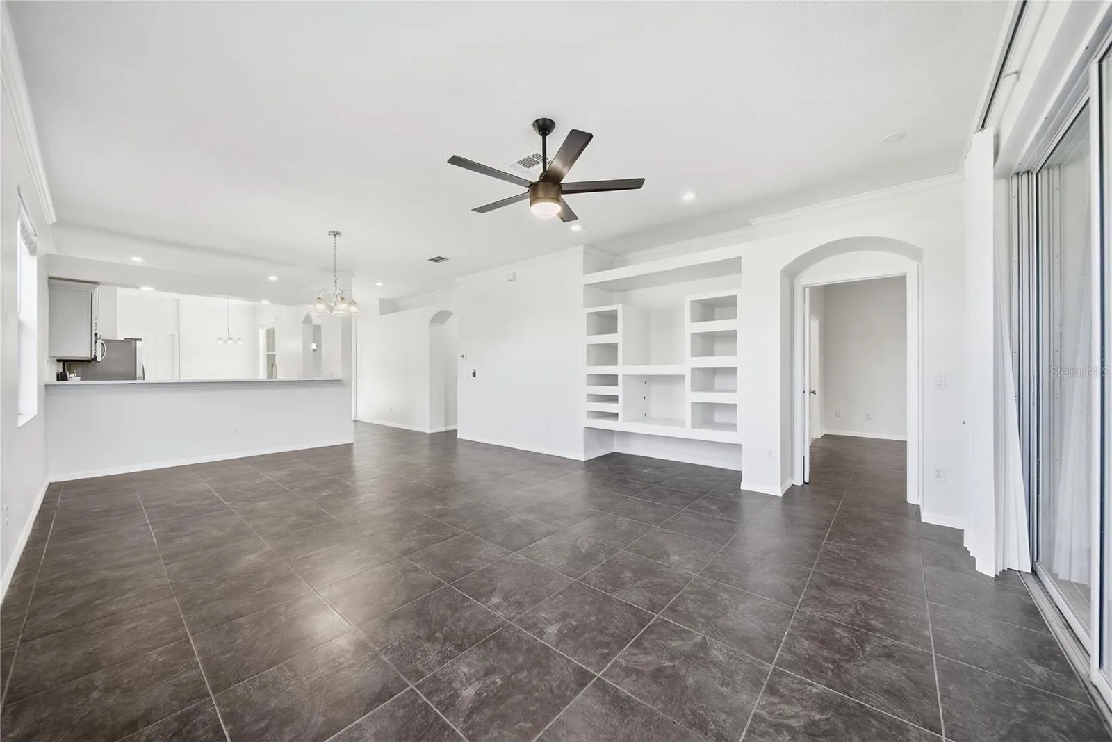 Bright and airy living room with built in shelves