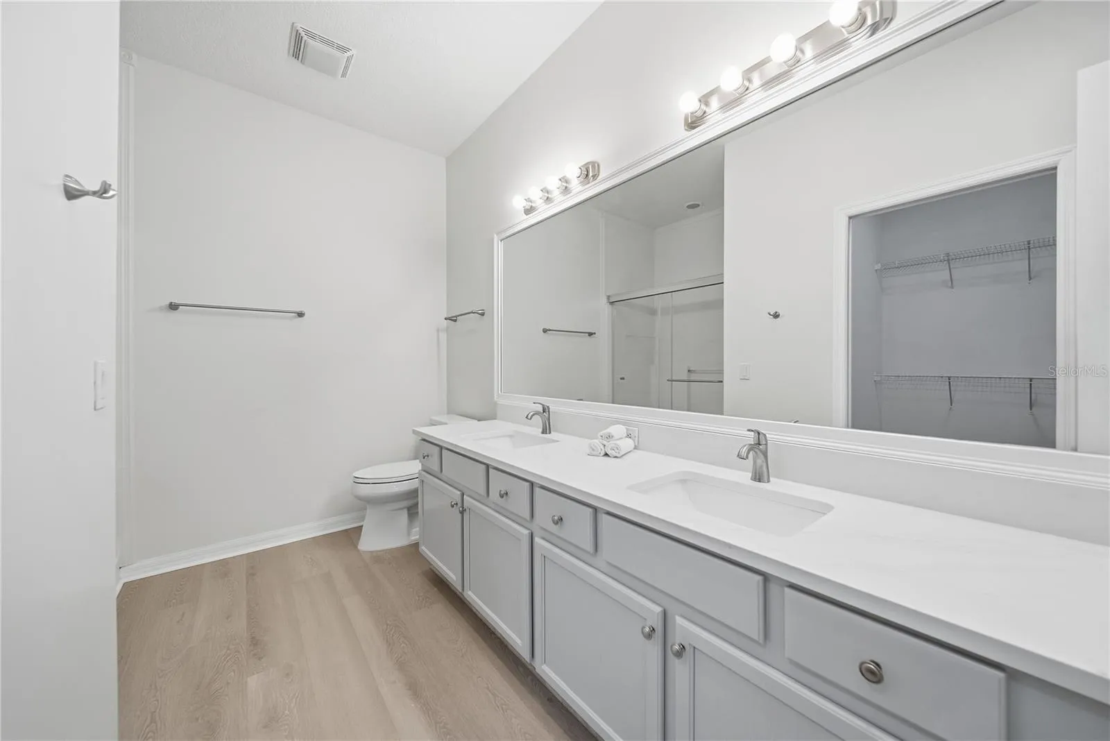 Updated Vanities with White Quartz Counters