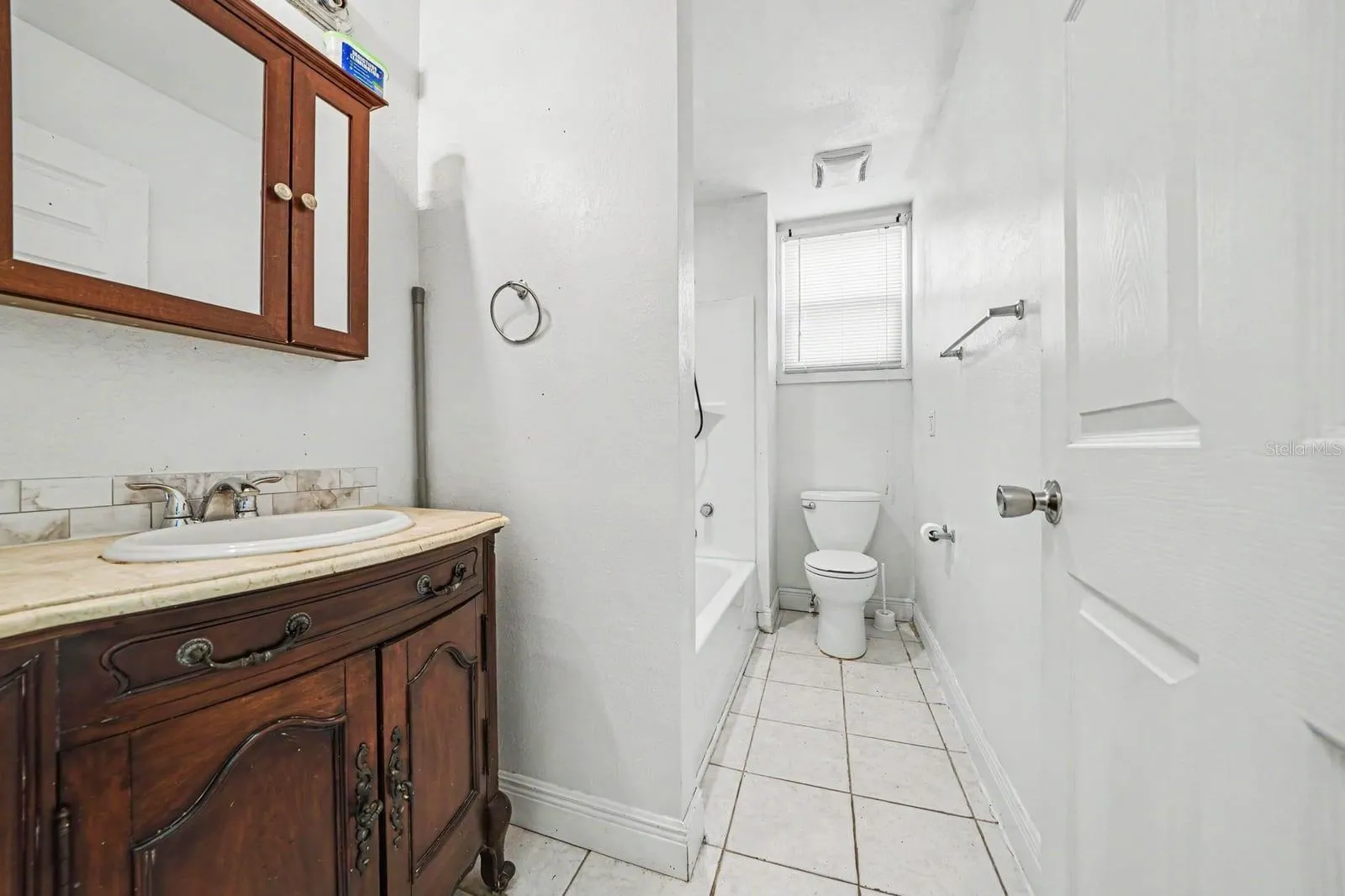 Master Bath with Wood Vanity, Separate Tub & Shower, Tile Flooring