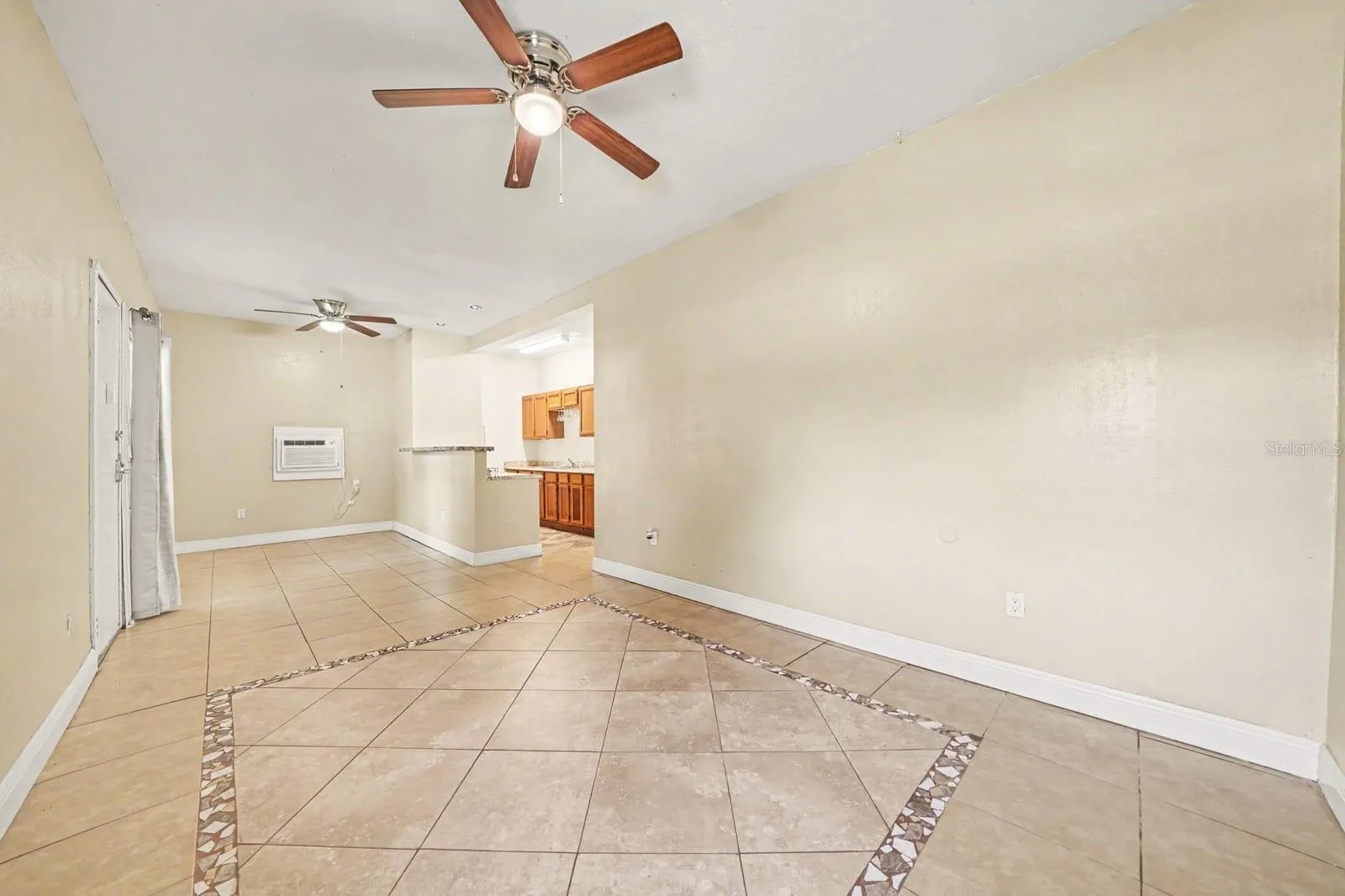 Open Floor Plan With Tile Details & Kitchen Cabinetry Access