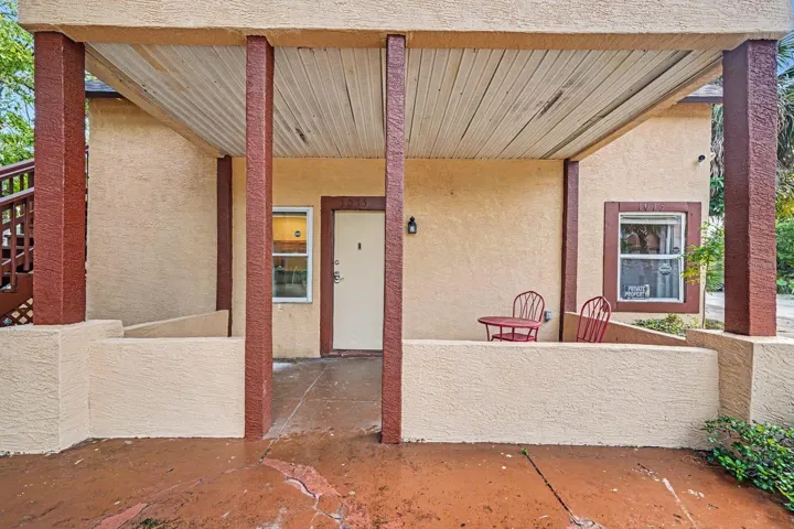 Covered Patio With Metal Beam Support & Brick Flooring