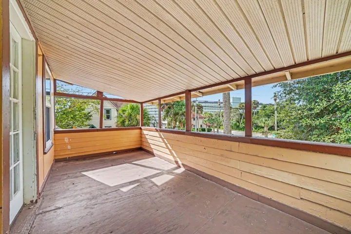 Screened Patio Area with Metal Roof Covering & Garden Views