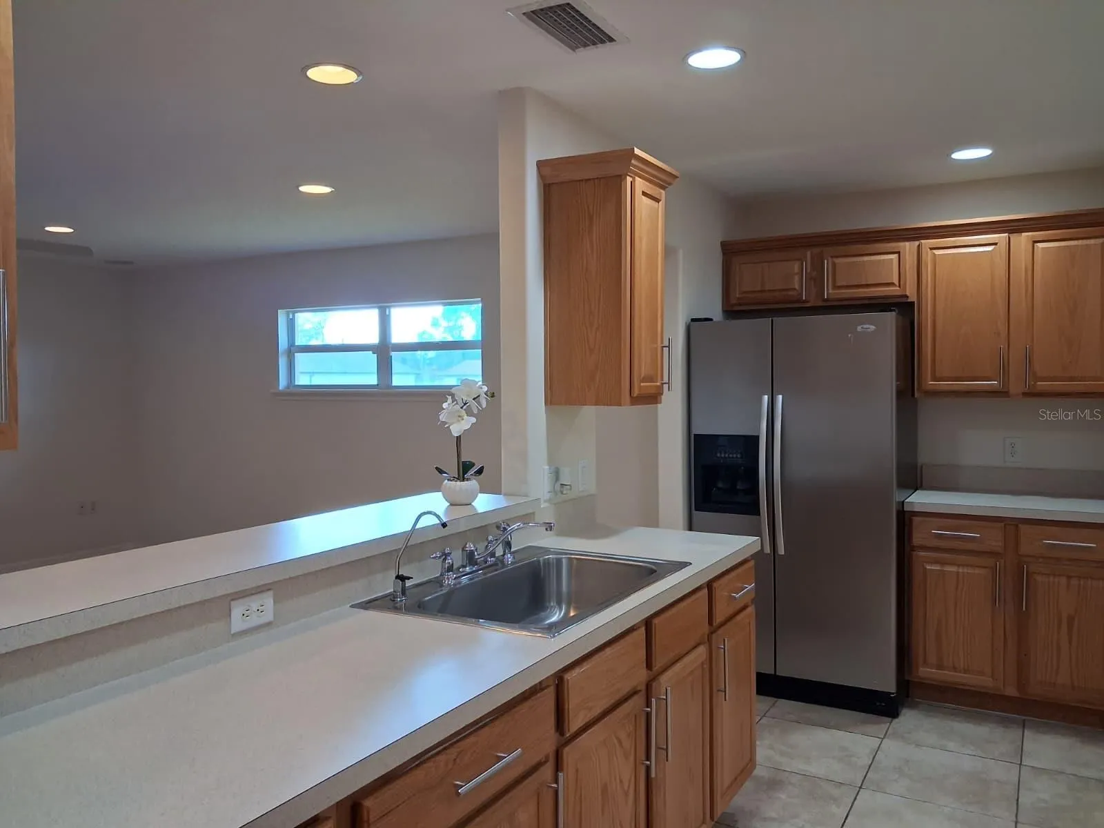KITCHEN-VIEW TO FAMILY ROOM