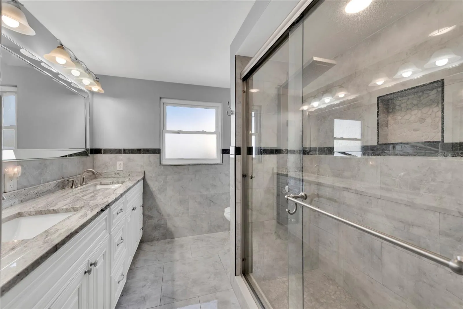 Primary EnSuite Bath ~ Dual Sinks ~ Stone ~ Updated Throughout