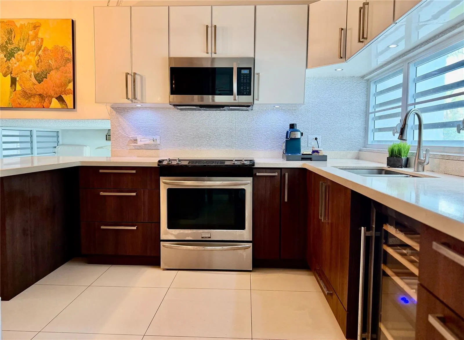 Remodeled kitchen with cabinetry and appliances.