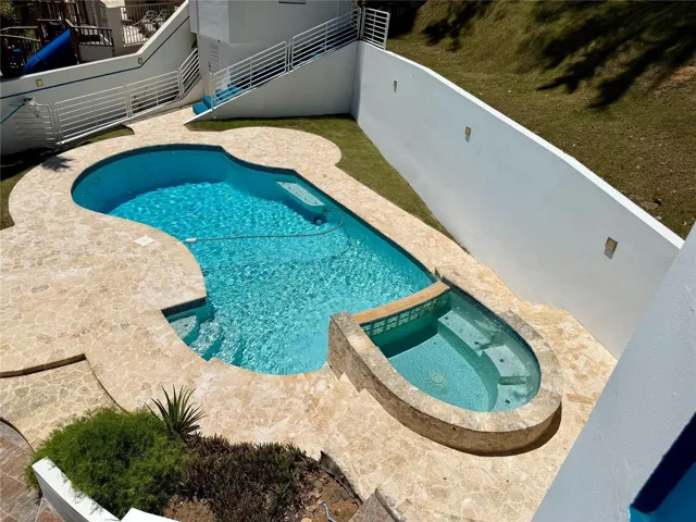 Elevated view of the pool and heated spa.