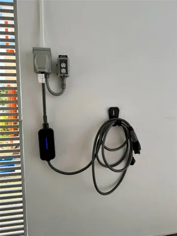 Electric vehicle charger in the carport.
