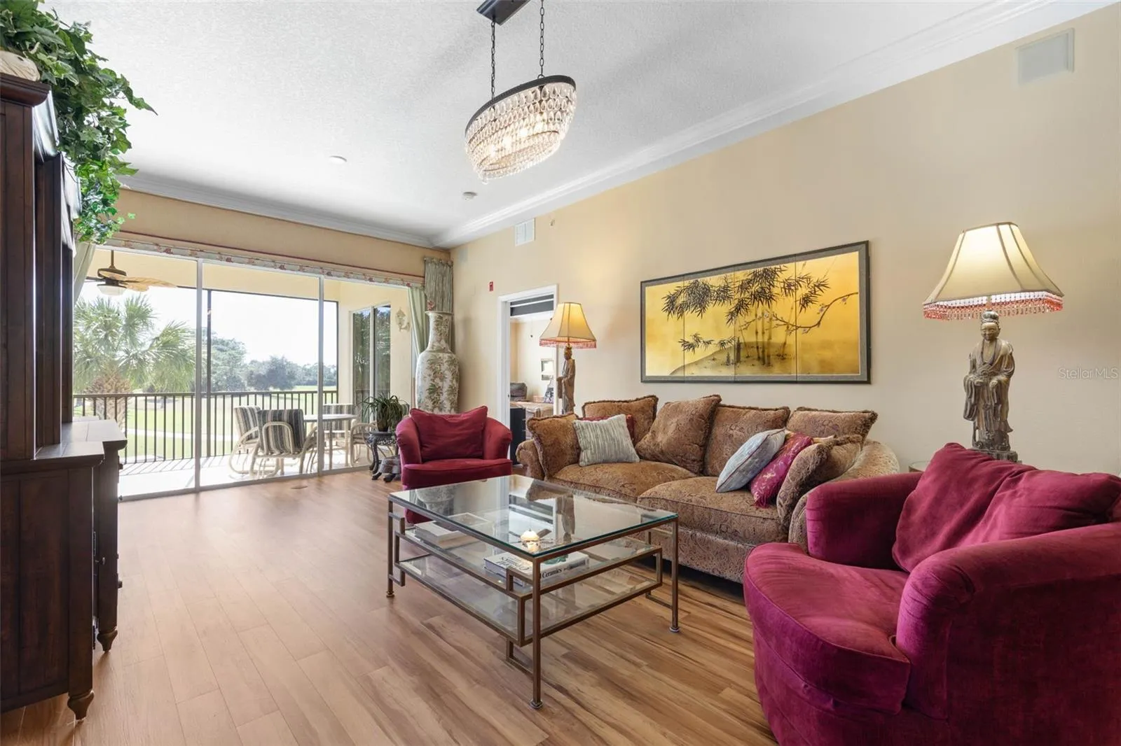 Light filled room with view of driving range and golf course