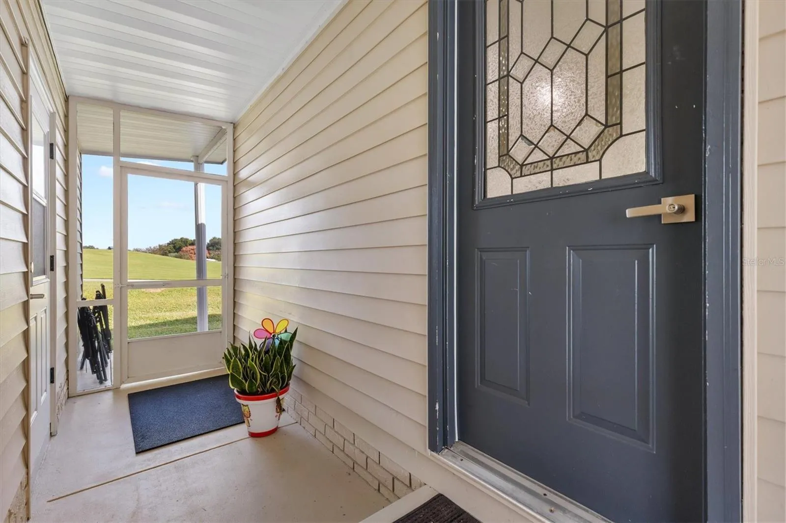 Entrance with door to back yard space