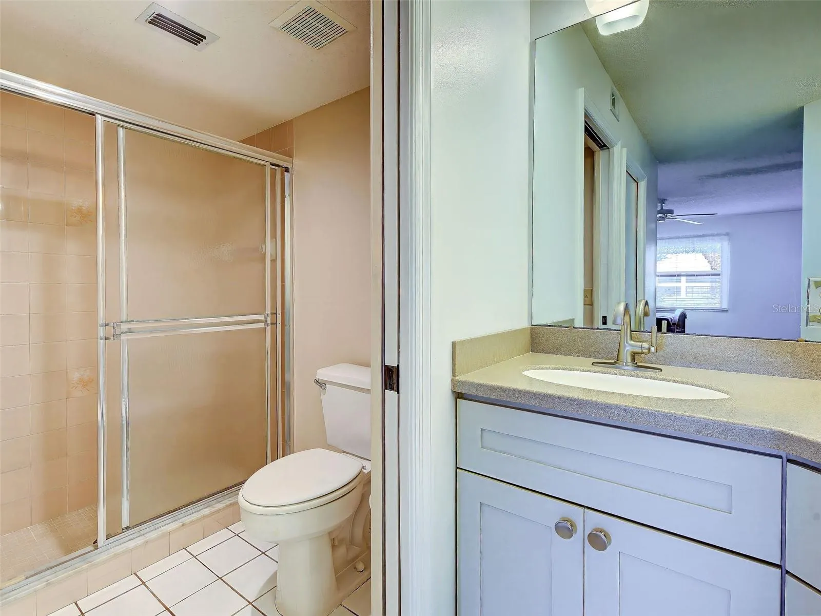 POCKET DOOR TO CREATE PRIVATE SHOWER SPACE.